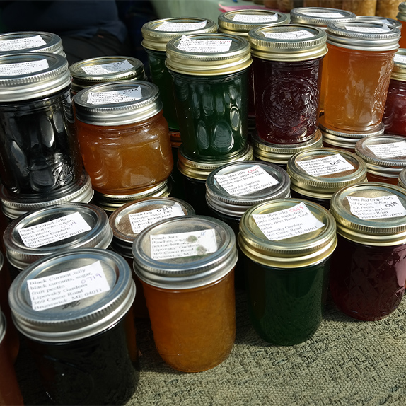 Jars of homemade multicolored jams and jellies