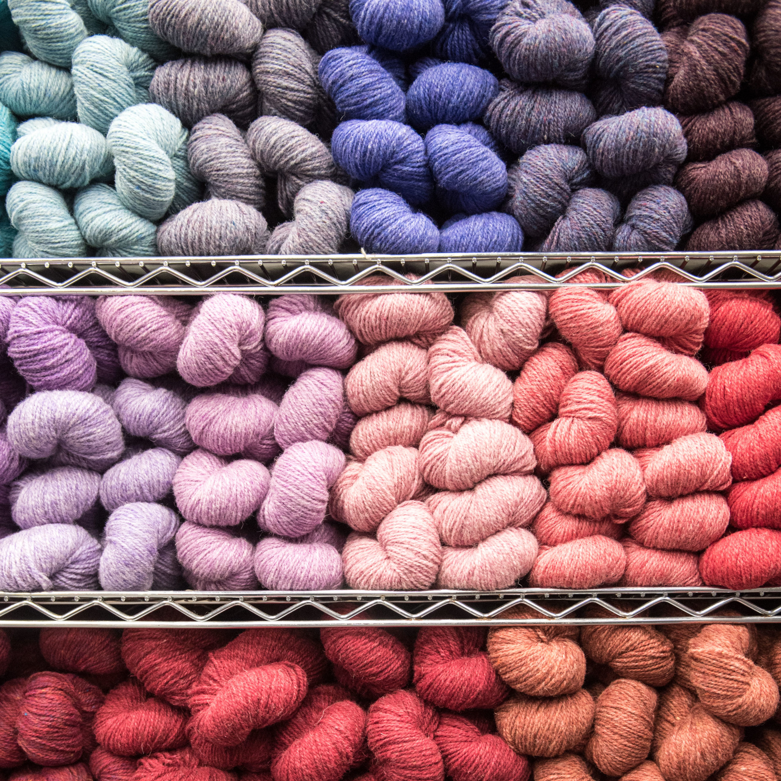 Fiber-for-Whats-in-Season-2 twisted hanks of yarn in a variety of colors