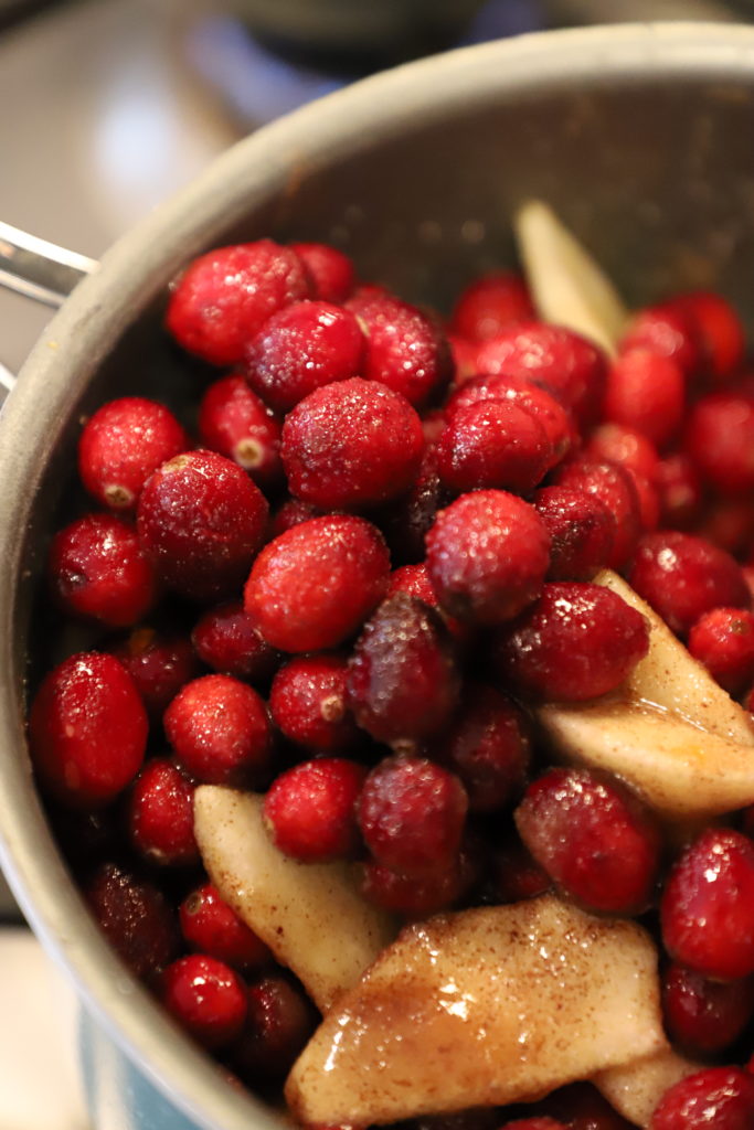 Cranberries cooking in a saucepan